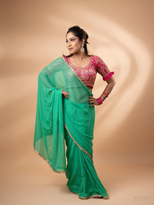 Green saree with pink stitched blouse
