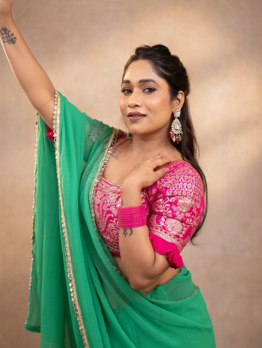 Green saree with pink stitched blouse