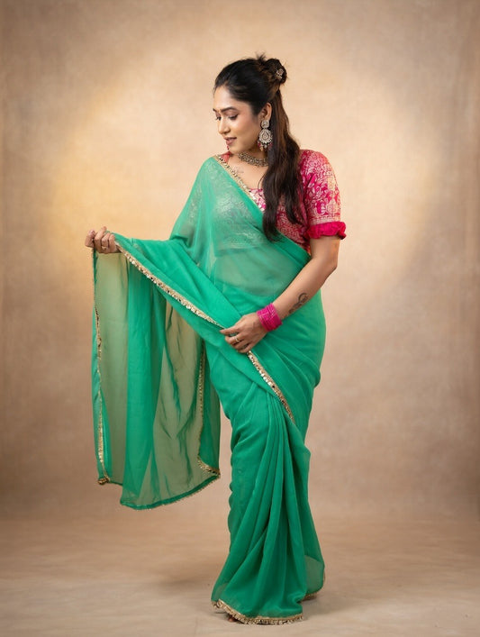 Green saree with pink stitched blouse