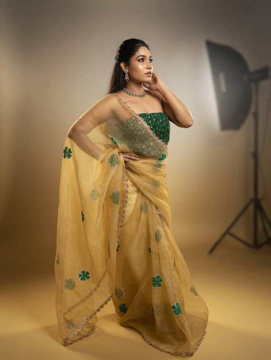 Golden Saree with  green painting and Green blouse