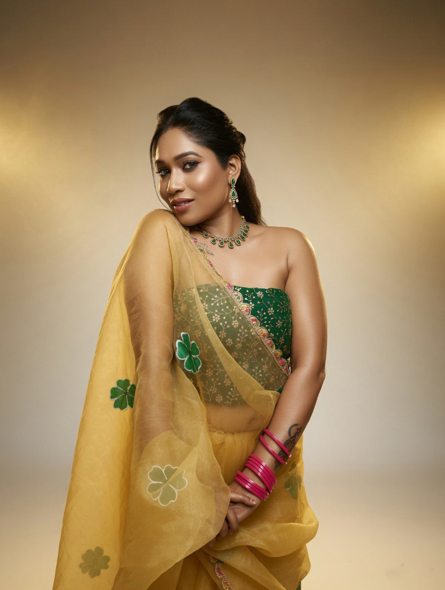 Golden Saree with  green painting and Green blouse