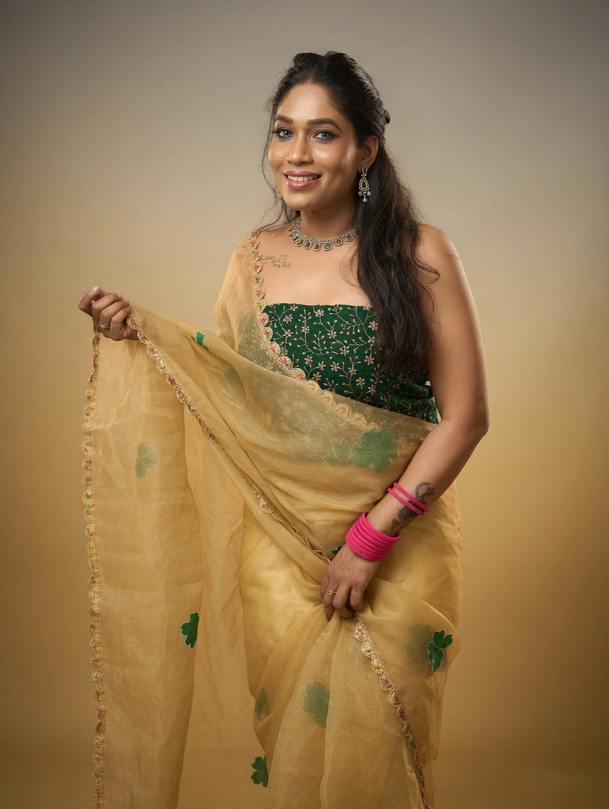 Golden Saree with  green painting and Green blouse