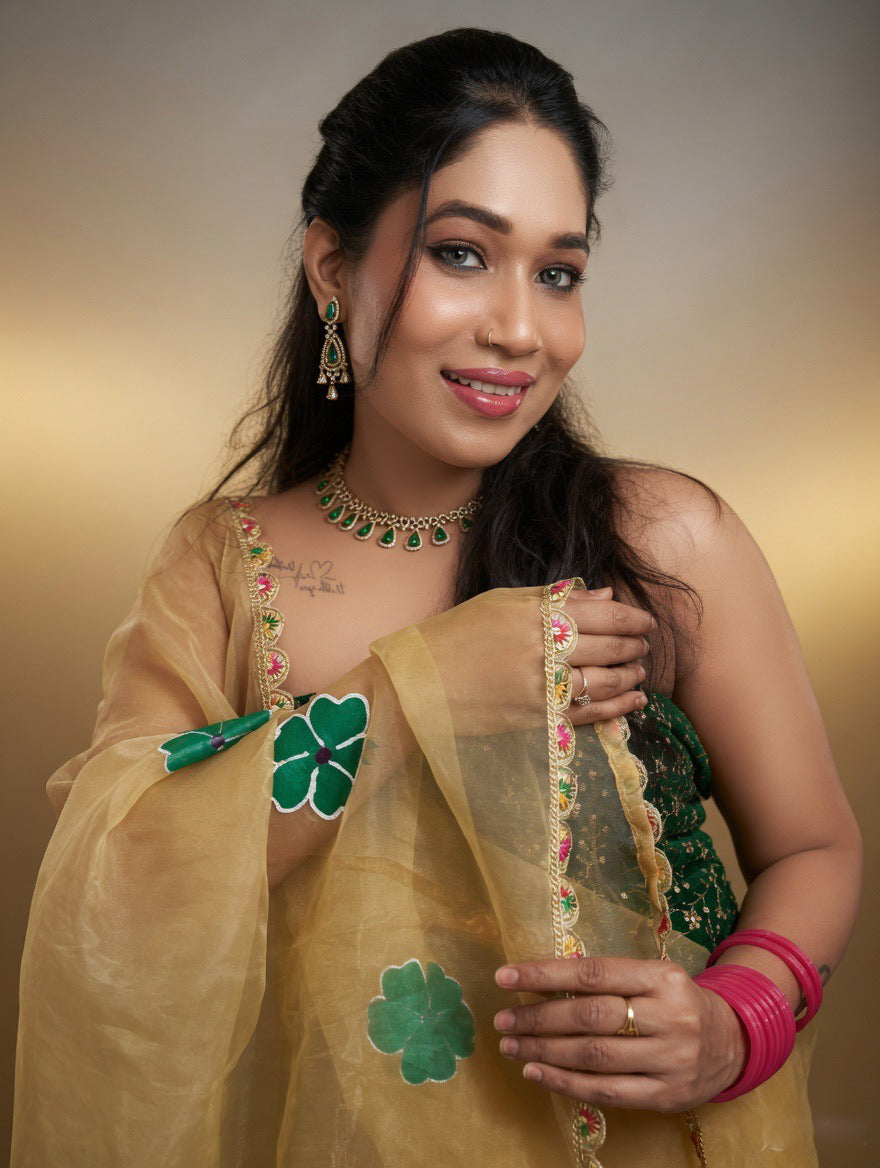 Golden Saree with  green painting and Green blouse