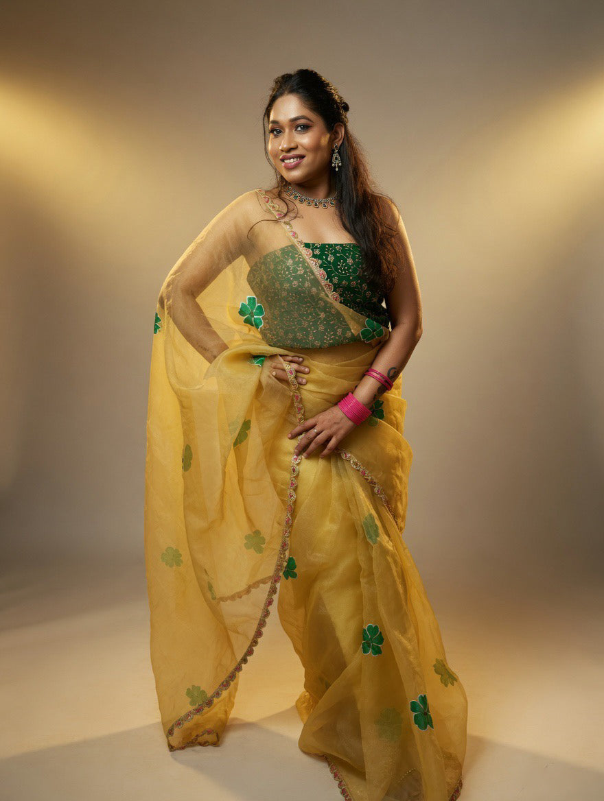 Golden Saree with  green painting and Green blouse