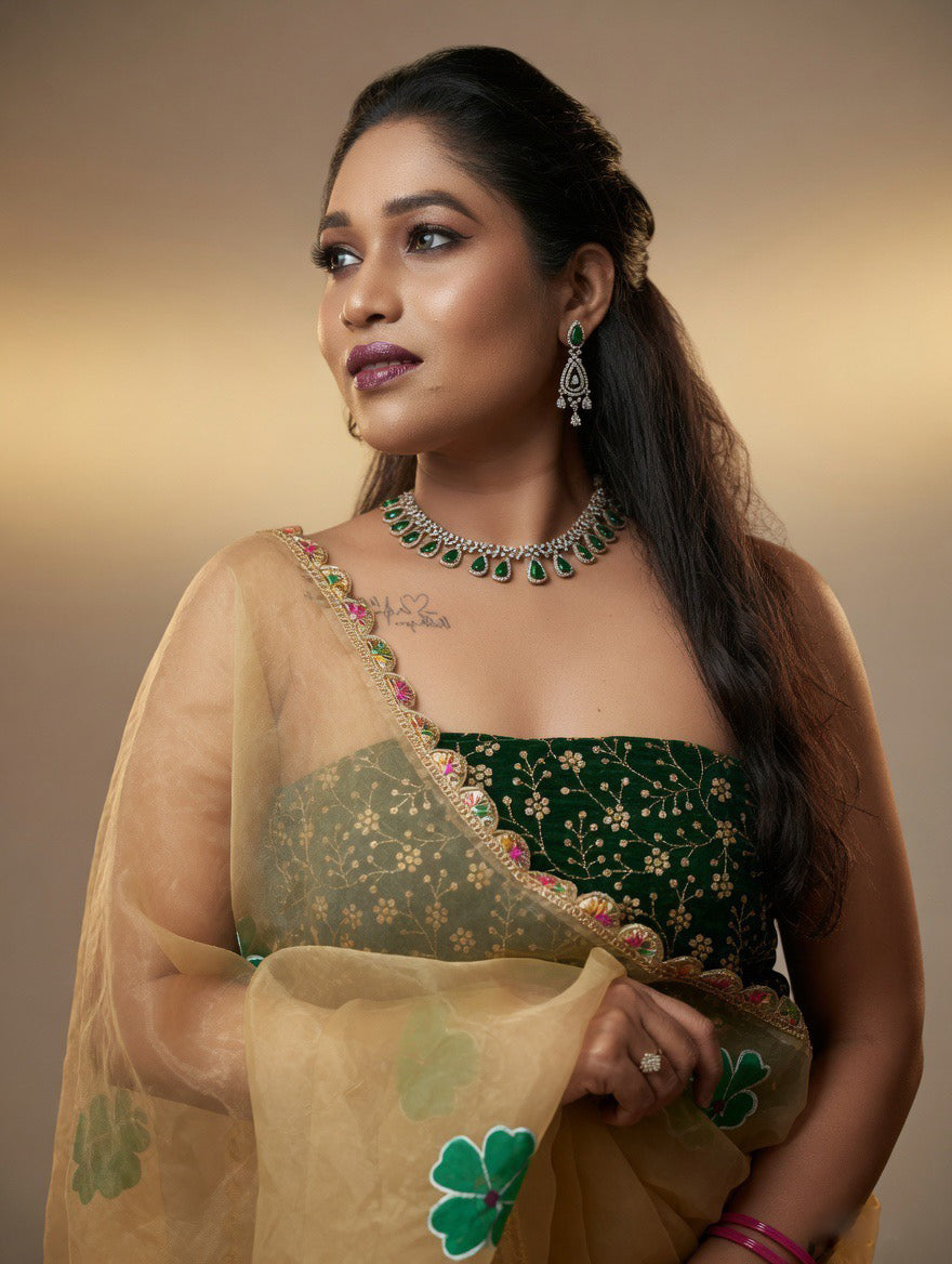 Golden Saree with  green painting and Green blouse