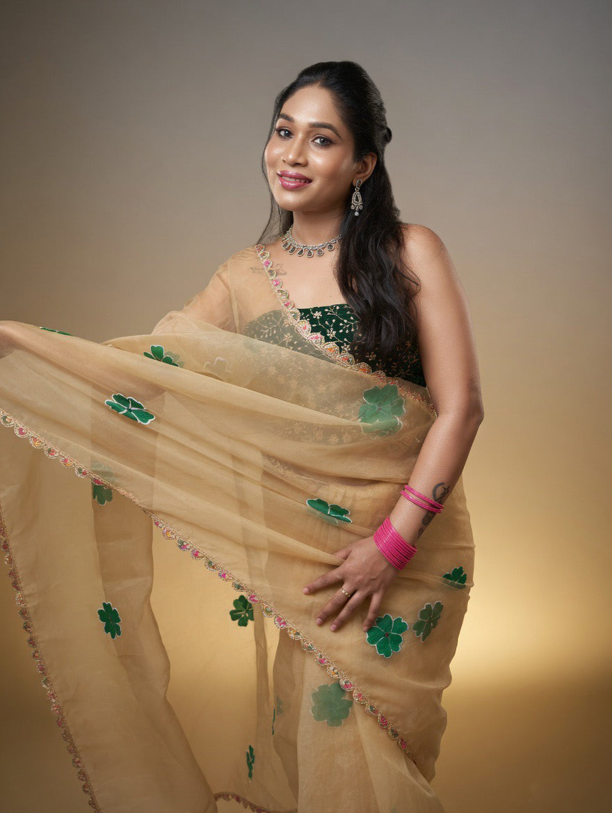 Golden Saree with  green painting and Green blouse