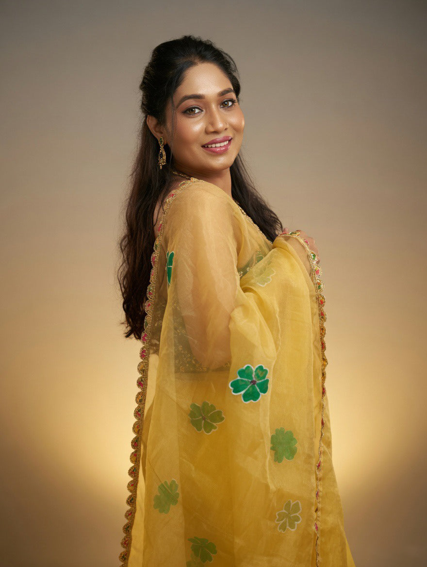 Golden Saree with  green painting and Green blouse