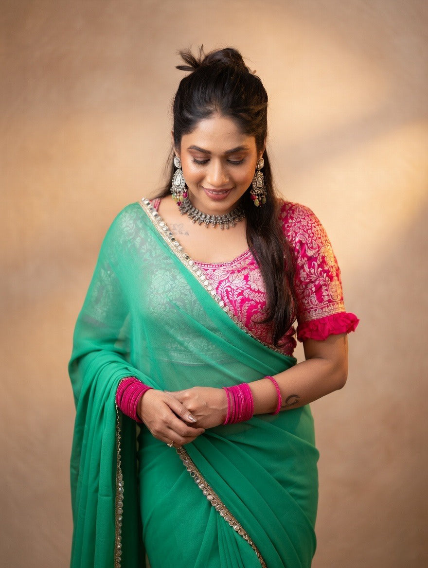 Green saree with pink stitched blouse